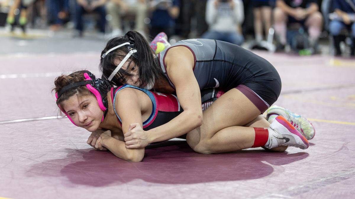 Centennial’s Ava Bui, top, pinned West Jefferson’s Alena Messerli, bottom, for the girls 100-pound title Saturday at the Rollie Lane Invitational. 