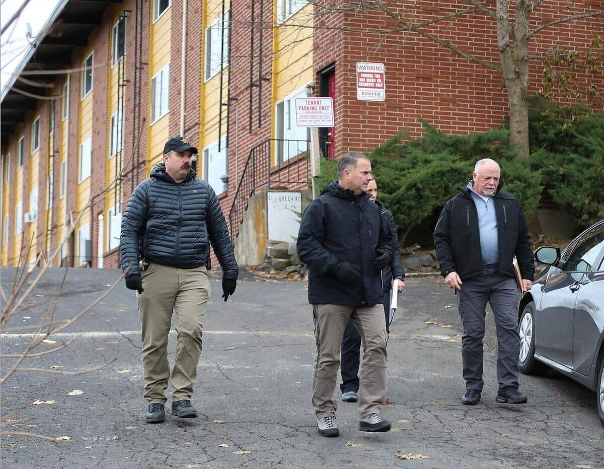 Idaho State Police detectives Lt. Mike Mooney, left, and Sgt. Darren Gilbertson, center, with other law enforcement personnel during their assistance with the investigation of the University of Idaho student homicides on King Road in Moscow.