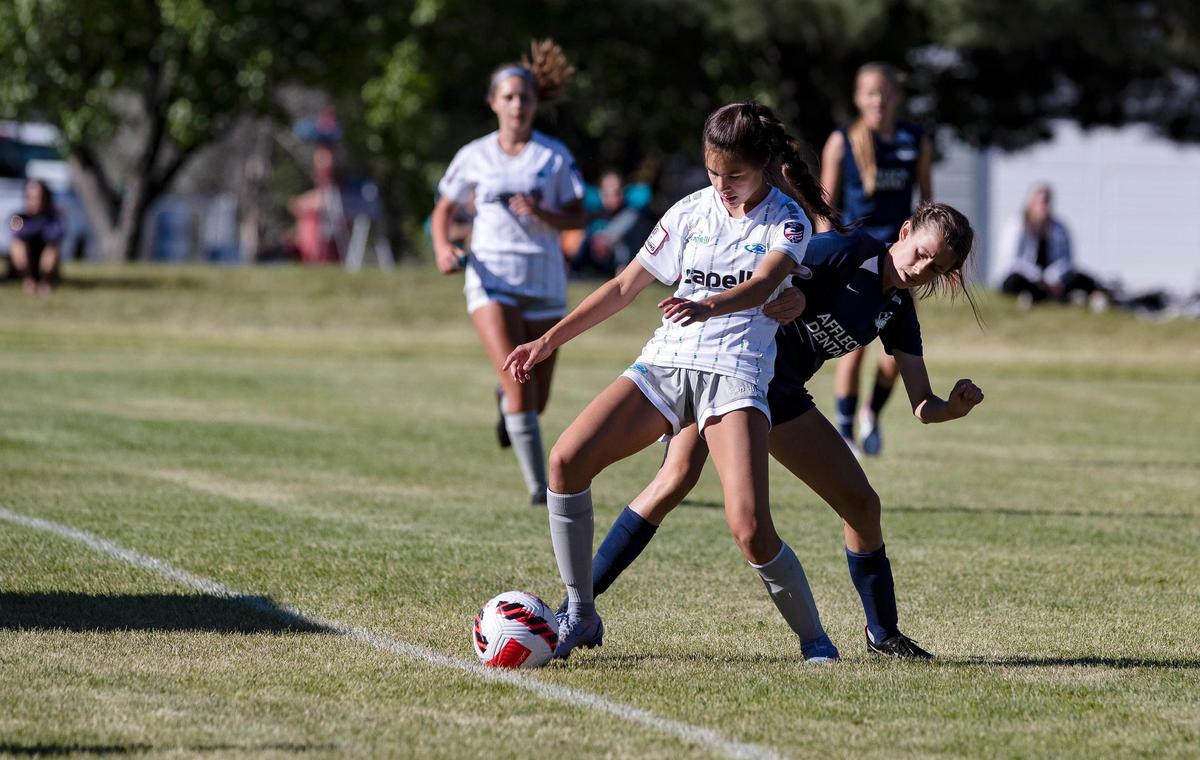 Francesca Truax of Idaho Rush, left, and Mattie Neves of Wasatch SC (Utah) compete in the U-15 girls final of the US Youth Soccer Far West Regional Championships at Simplot Sports Complex in Boise on Sunday.