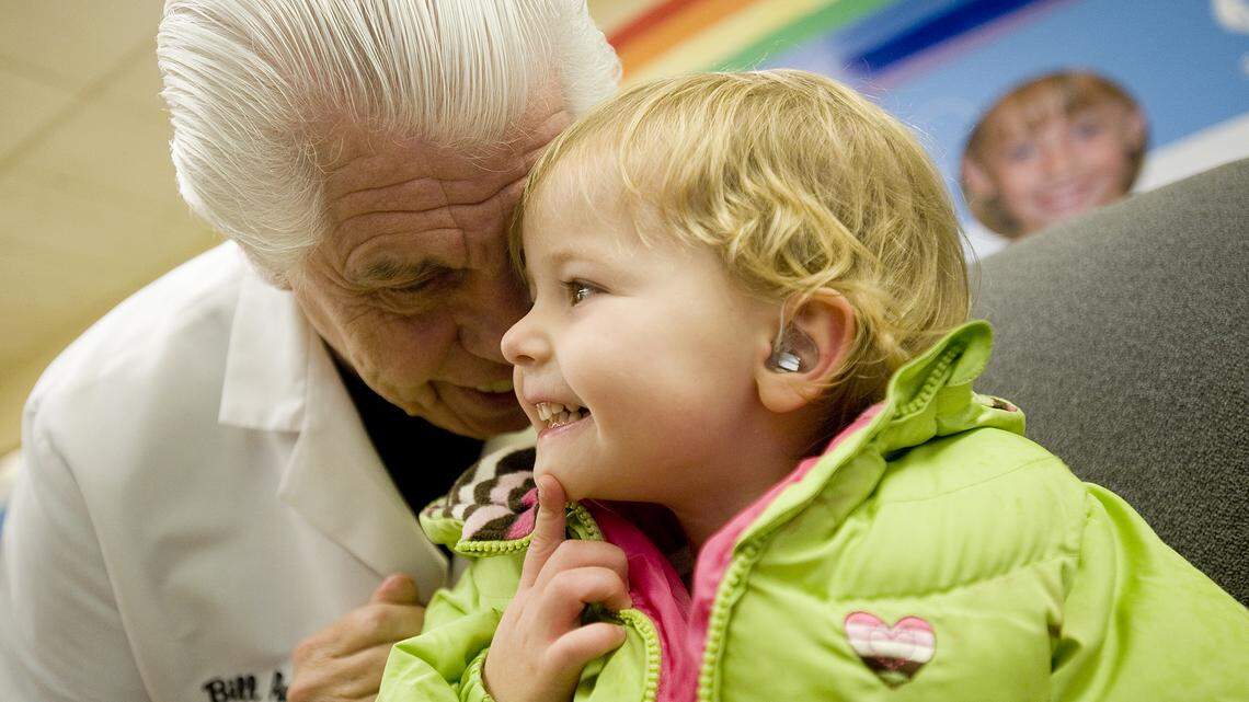 Savannah Andersen, 3, is fitted with a new hearing aid at the Washington School for the Deaf in Vancouver, Wash.
