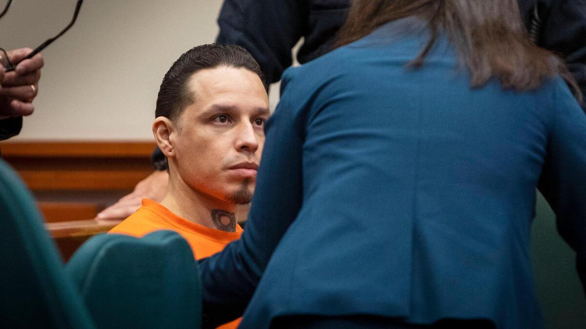 Erik Osuna listens to his defense attorney as his sentencing begins in 4th District Court, Thursday, Oct. 20, 2022, at the Ada County Courthouse in Boise. Osuna pleaded guilty to first-degree murder in the death of his 9-year-old son, Emrik Osuna, who died in September 2020.