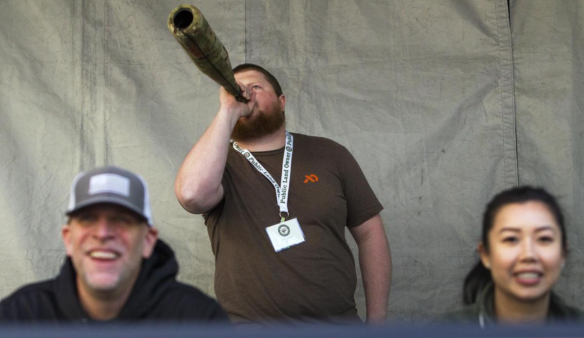 Jack Lander, Salem, Ore., bugles his winning elk call over the heads of judges Donnie Drake, Caldwell, and Jenny Ly, Vancouver, BC, in the finals of the elk bugling contest Friday, May 3, 2019 at the Grove Plaza. The contest was part of the Backcountry Hunters and Anglers Rendezvous being held in Downtown Boise.