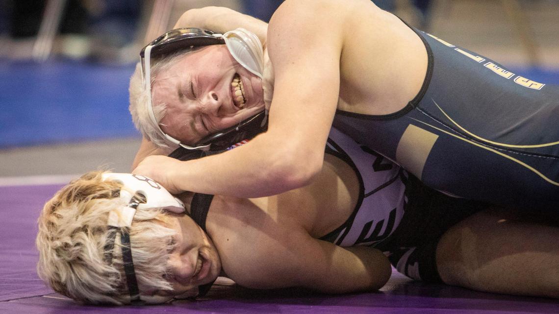 Capital High’s Jamison Hunt, on top, bests Eagle’s Riggin Stone 8-6 in a 5A, 126-pound bout Friday at the Idaho Center. The state wrestling tournament began Friday and concludes Saturday. The finals begin at 3:30 p.m.