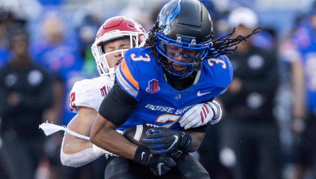 Boise State wide receiver Latrell Caples tries to drag a Fresno State defender after catching a pass in the home loss three weeks ago.