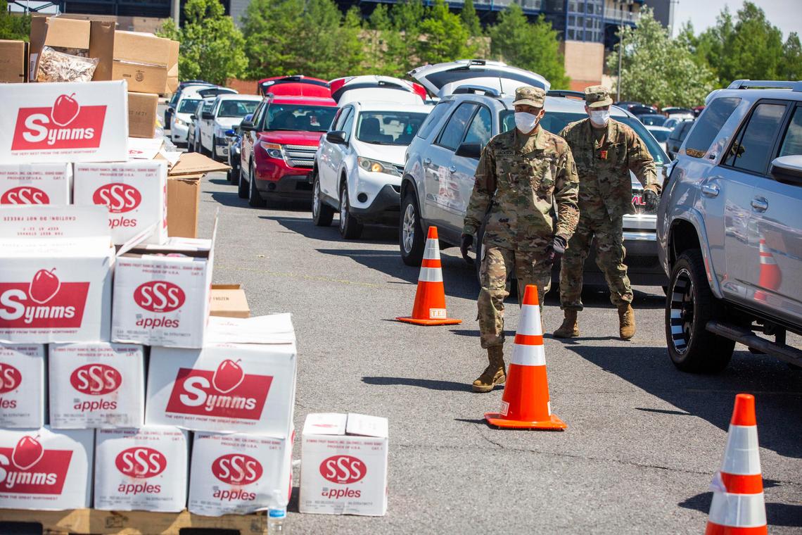 Boxes of apples from Symms Fruit Ranch in Caldwell wait to be handed out last month at a food handout at the Shrine on Airline stadium outside New Orleans. Second Harvest Food Bank workers, with help of the Louisiana National Guard, gave food to people in more than 2,000 cars at the stadium parking lot, located six miles southeast of Louis Armstrong New Orleans International Airport.