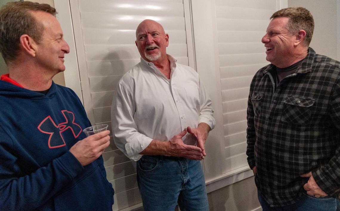 Eagle City Council President Brad Pike, center, talks with Jim Macfarlane, left, and Brian Sims, right, during his election night watch party at his home in Eagle, Tuesday, Dec. 5, 2023. Pike won the runoff election race for mayor of Eagle against incumbent Mayor Jason Pierce.