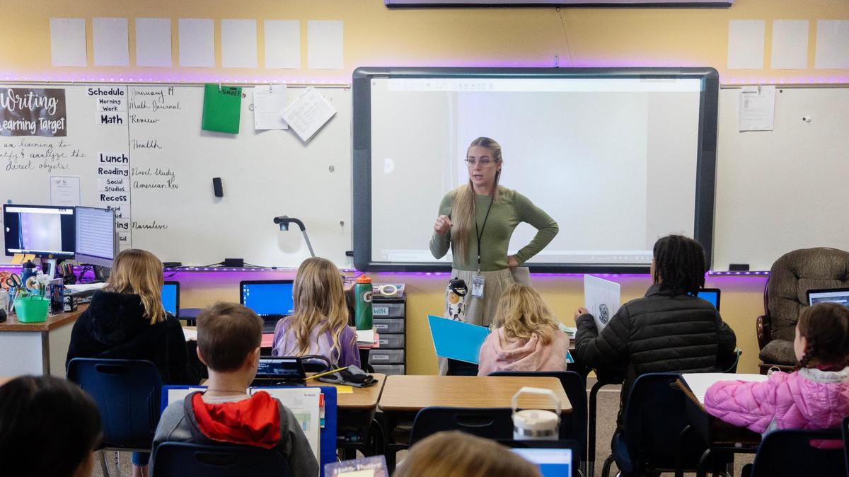 Siena Elementary School fifth grade teacher Sydney Peery explains a concept to her students. As the district’s school-age population keeps growing, it keeps adding schools and hiring more employees.