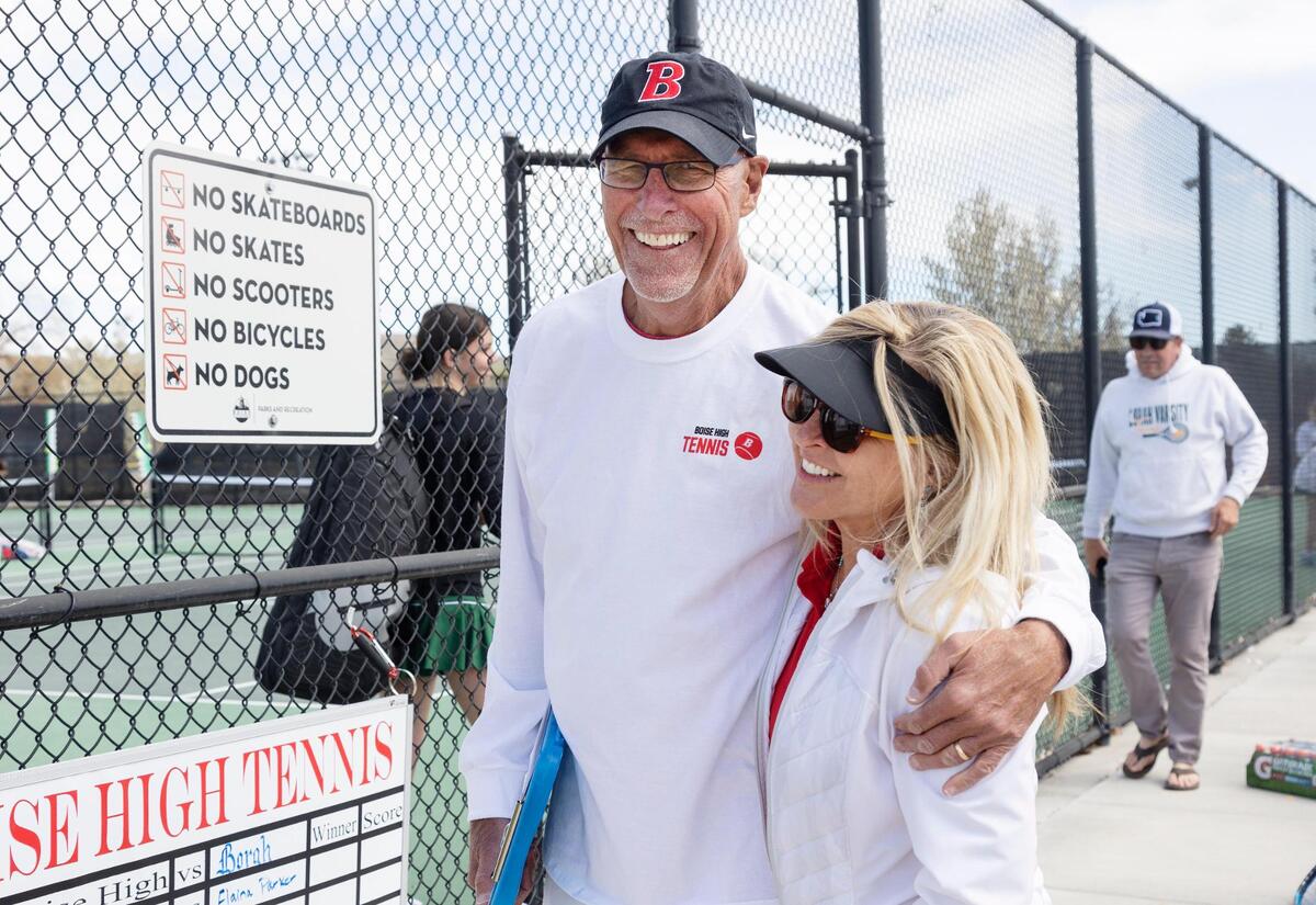 Greg Patton and his wife, Christa Patton, coach at a Boise High tennis match on April 20.