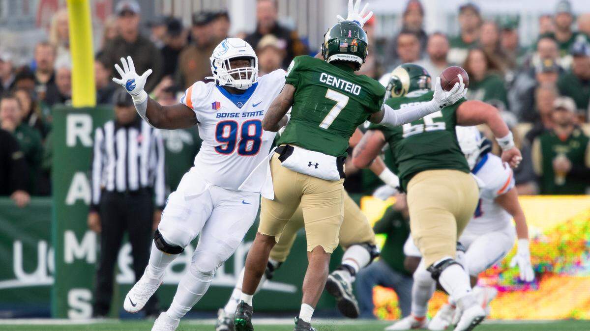 Boise State defensive tackle Herbert Gums pressures former Colorado State quarterback Todd Centeio during a game last season. Gums was a 250-pound running back at Diboll High School in Texas.
