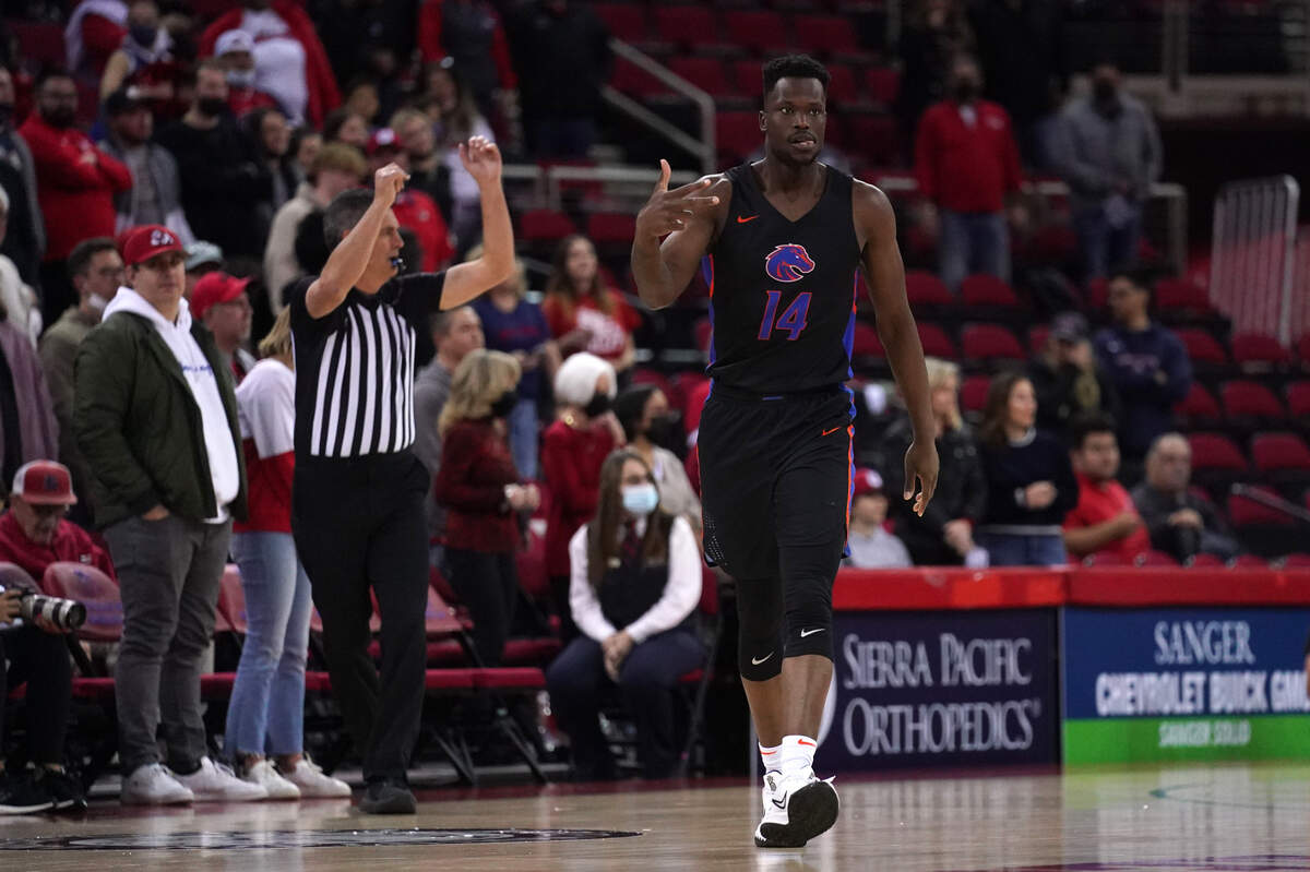 Emmanuel Akot celebrates a late 3-pointer that helped Boise State defeat Fresno State 68-63 in overtime Friday at Save Mart Center in Fresno, California.
