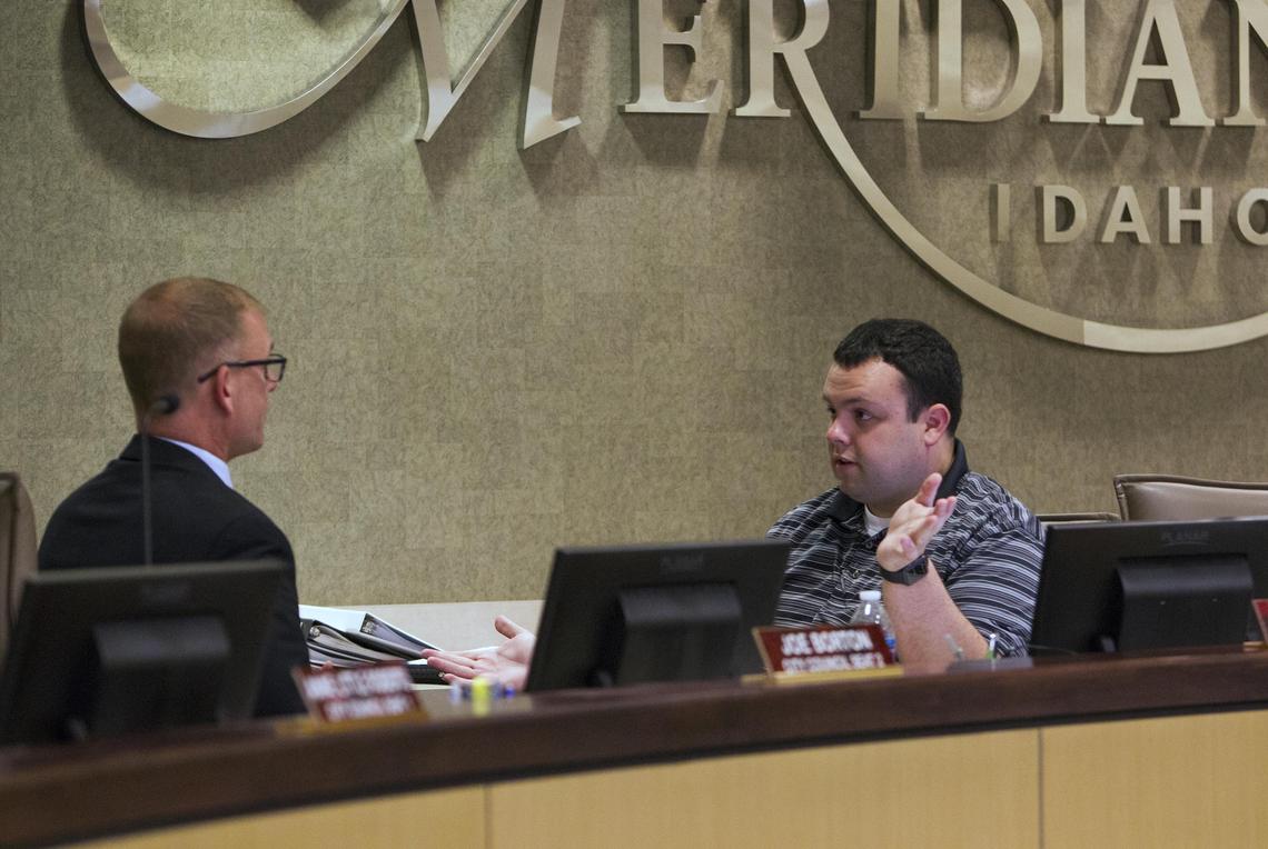 Meridian City Councilmen Joe Borton, left, and Ty Palmer talk before Tuesday night’s hearing where the council heard public testimony on an ordinance to prohibit discrimination against LGBTQ people. Borton sponsored the ordinance.  Palmer opposed it. The ordinance passed, 4-2.