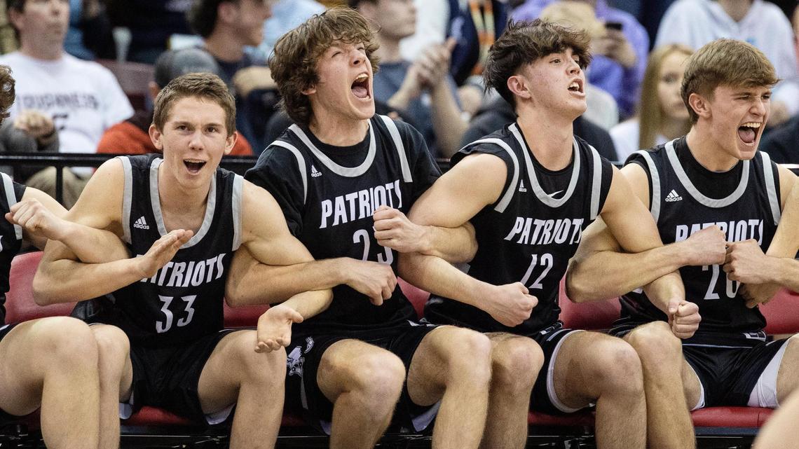 Centennial celebrates in the final seconds of its 61-53 win over Rigby in the 5A boys basketball state semifinals on Friday at the Ford Idaho Center.