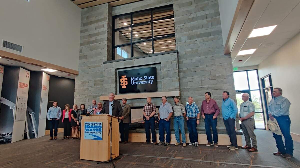 Lt. Gov. Scott Bedke speaks at a press conference in Pocatello, flanked by representatives of both sides of the East Snake Plain aquifer conflict.