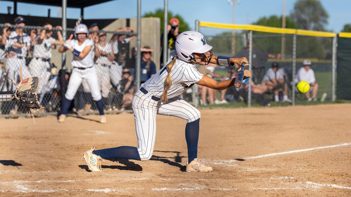 Mountain View senior Afton Janke squares around for a bunt Tuesday.