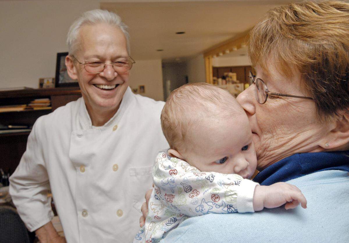 In this 2005 file photo, six-week-old Daniel David Martin settles into his mother’s arms after being held by his father. Kirt and Carol Martin of Hagerman decided to build a family together with the help of surrogate mothers. Kirt Martin, a Cordon Bleu chef, operates Snake River Grill in Hagerman.