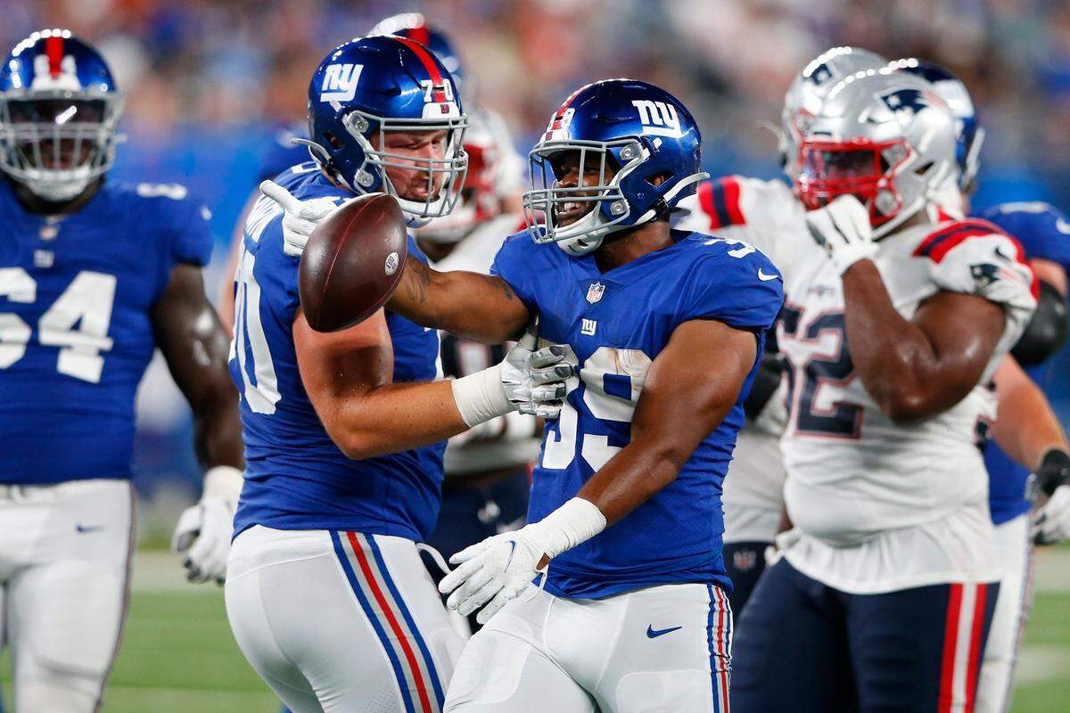 New York Giants running back Elijhaa Penny, a former Idaho standout, celebrates after a run during the second half of an NFL preseason football game against the New England Patriots on Aug. 29 in East Rutherford, N.J. Penny made the Giants’ 53-man roster.
