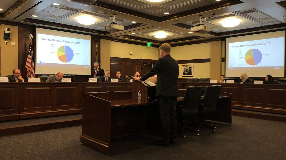 Idaho Association of Counties Director Seth Grigg makes a presentation to the Legislature's property tax working group at the Capitol on Nov. 18, 2019.