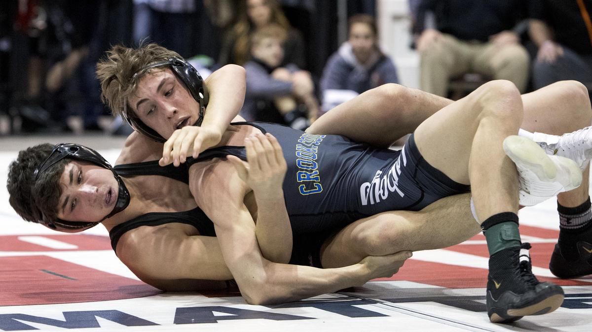 Ridge Lovett of Post Falls works on Zachary Mauras from Crook County, Ore. during the 132-pound championship match in at Rollie Lane Invitational Saturday at the Idaho Center in Nampa. Lovett pinned Mauras to win the title.