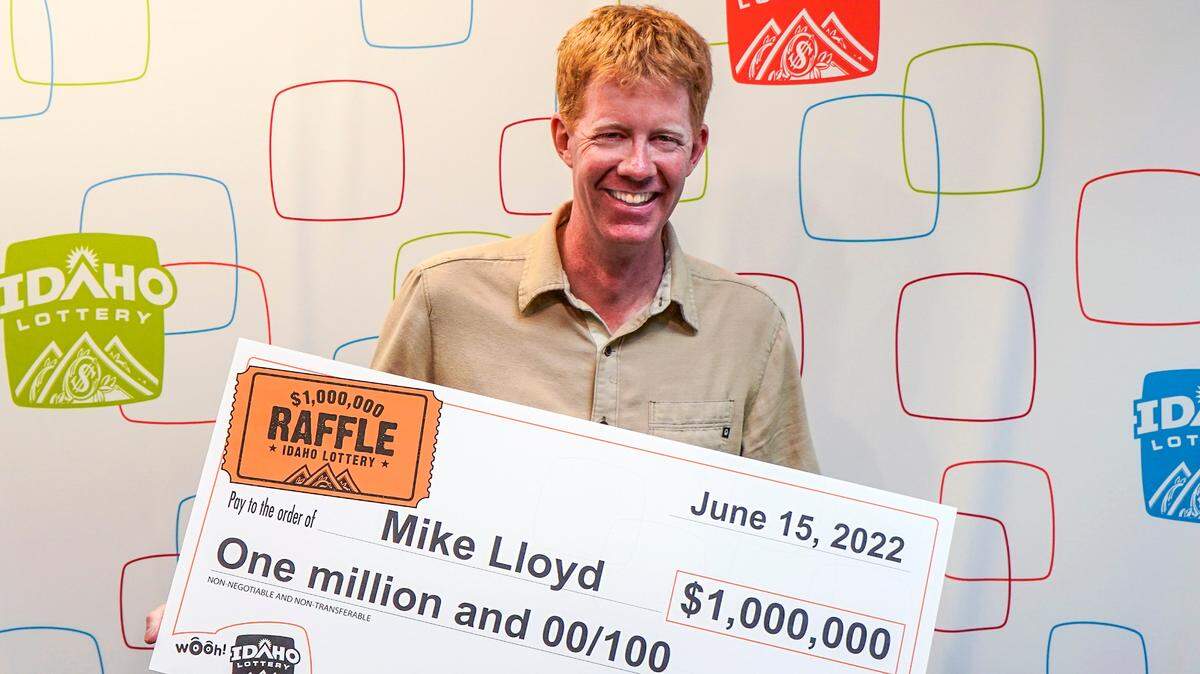 Mike Lloyd of Ketchum poses with an oversized check for $1,000,000 after winning the Idaho Lottery.