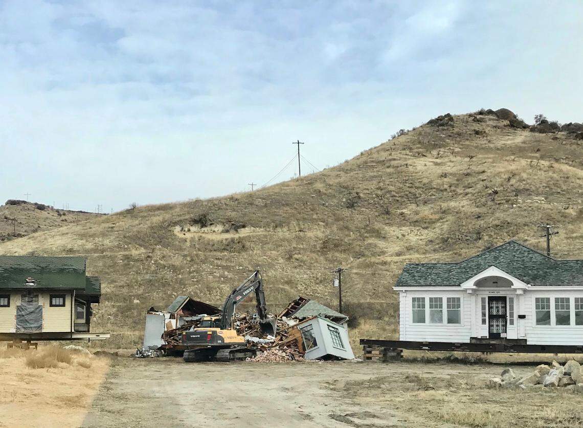 Kerry and Steve Calverley bought six historic homes that St. Luke’s otherwise would have demolished to expand its downtown Boise campus. The couple ended up demolishing two of them and finding new homes for the other four. The house on the right was saved and moved to a permanent location near the Warm Springs golf course. The house in the middle —&nbsp;a Tudor-style cottage that was moved from 174 W. Jefferson —&nbsp;was demolished.