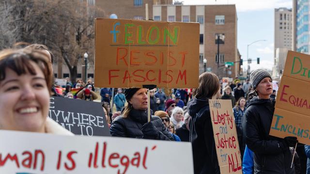 People hold a demonstration as part of the 50 protests, 50 states, one day movement Wednesday outside of the Idaho Capitol. The demonstration was held in protest of recent actions taken by President Donald Trump’s administration.