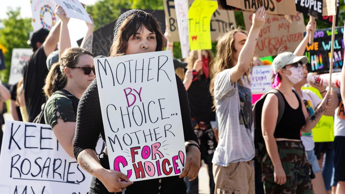 Jessica Kumple holds a sign at a 2023 abortion rights protest. Businesses told the U.S. Supreme Court that Idaho’s restrictive abortion laws are impacting the state economically.