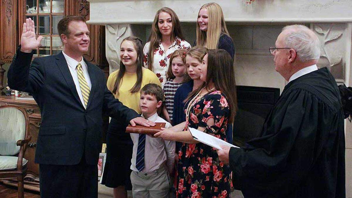 Ryan Nelson is sworn in to serve on the 9th U.S. Circuit Court of Appeals by Judge N. Randy Smith, with his family behind him.