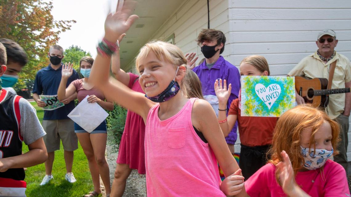 Like roving minstrels, members of Calvary Boise sing songs to residents of Creekside Memory Care from outside, because of coronavirus restrictions.