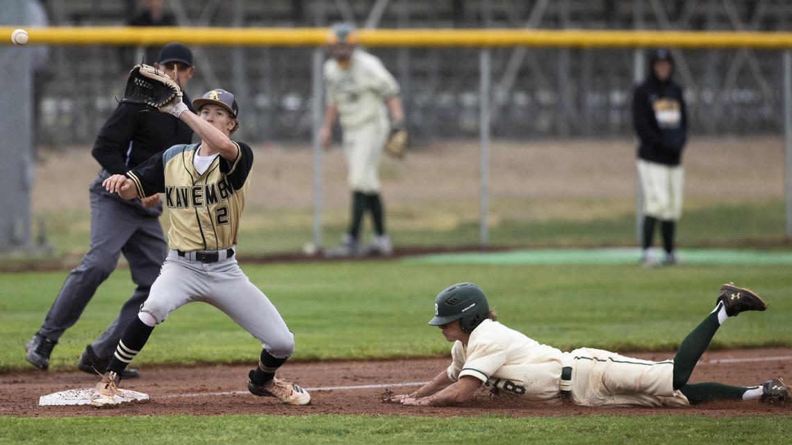 Kuna third basemen Cole Newman catches a throw from home plate but it’s behind Bonneville base stealer Bruer Webster in the state 4A tournament Thursday, May 16, 2019, at Vallivue High in Caldwell.