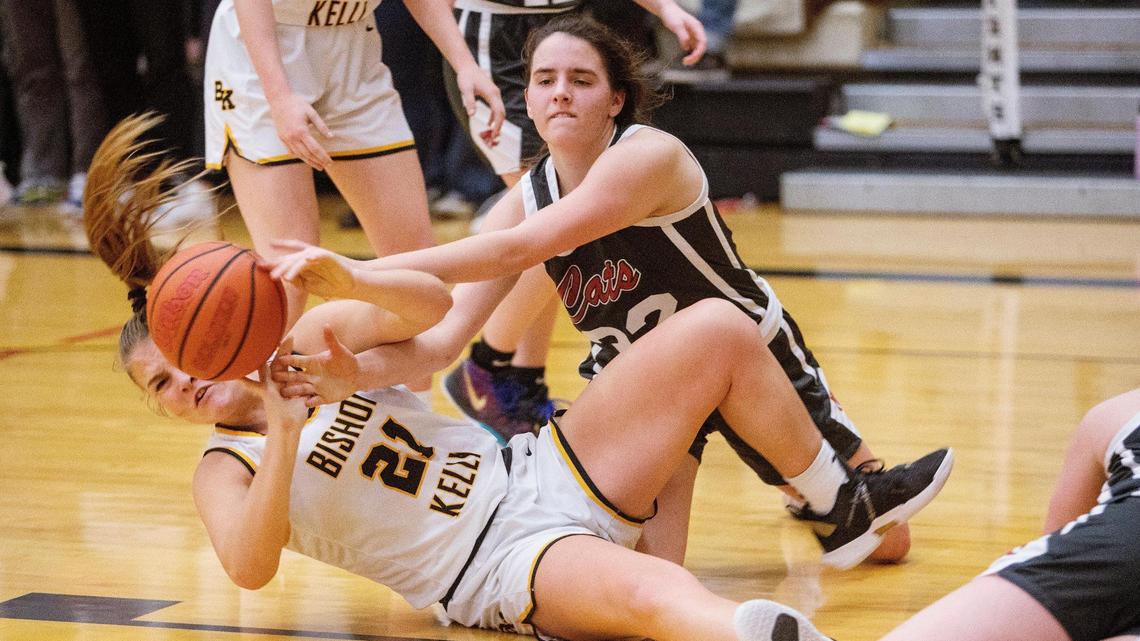 Columbia junior Mylie Mills, right, was voted the 4A SIC Player of the Year by the league’s coaches. tumble to the floor in their 4A District Three girls basketball tournament semifinals match at Bishop Kelly on Tuesday, Feb. 8, 2022.