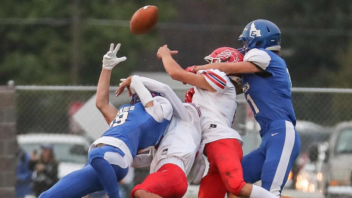 Emmett wide receivers and Nampa defensive backs all battle for a long pass Friday at Emmett High.