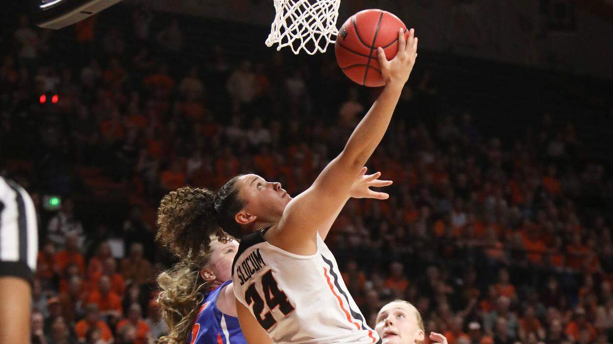 Oregon State’s Destiny Slocum gets around Boise State’s Rachel Bowers for a reverse layup as the Beavers edged the Broncos 80-75 in overtime Saturday at Gill Coliseum in Corvallis, Oregon.