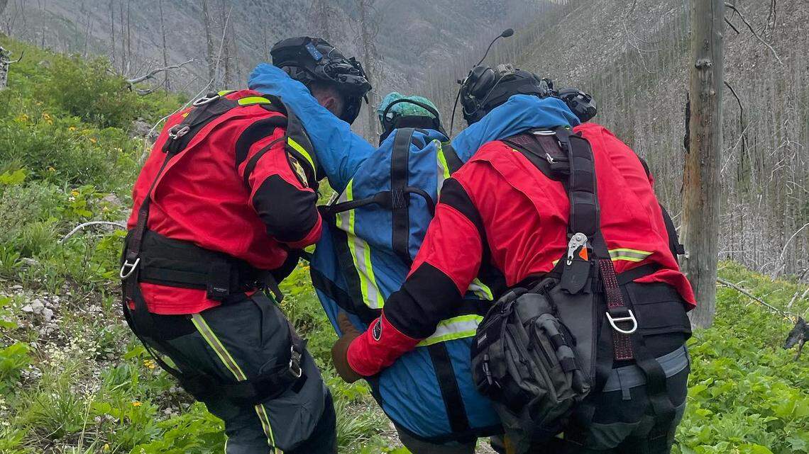 A woman was stranded near grizzly bear poop while on a hike in Montana, rescuers said.