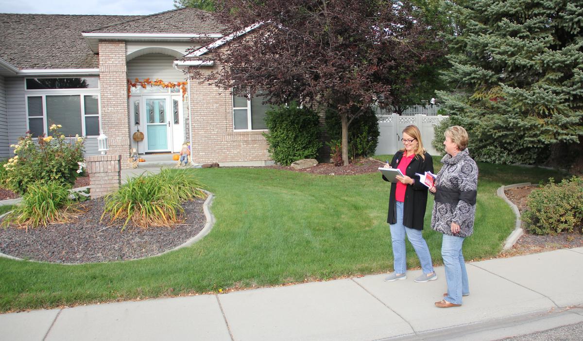Anne Little Roberts, left, walks with long-time friend Bibiana Nertney down a street in South Meridian. When voters asked why she was running, she told them that she appreciated longtime Mayor Tammy de Weerd’s leadership but believed that her vision for the city could use a “tweak.”