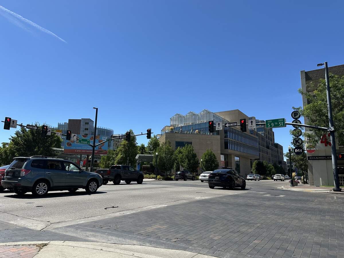 Several cars run the red light at Front and 9th streets on Tuesday, Aug. 5, 2025, in downtown Boise. Two more cars followed this group through the intersection.