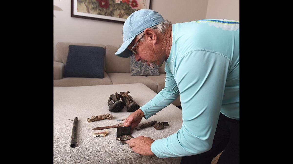 Jeff Jones displays some of the artifacts found with the remains of his father who went missing while hunting in Idaho 53 years ago.