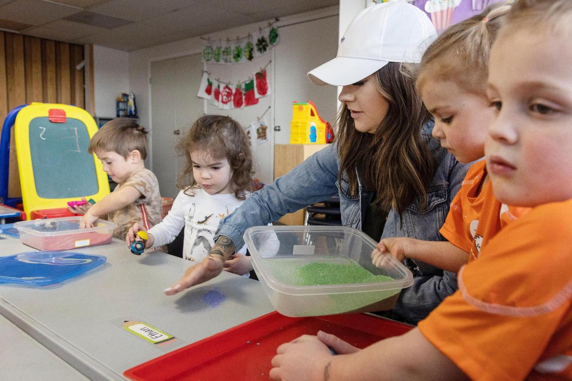 Baylee Johnson plays with children.