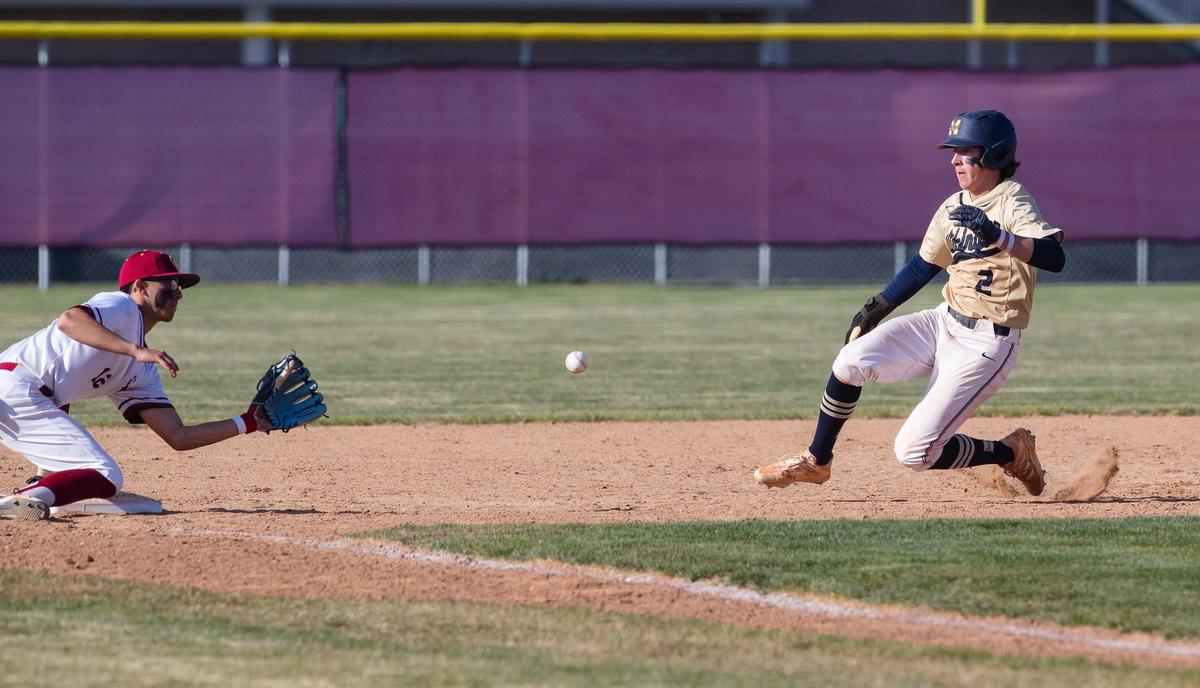 Columbia junior Lewis Anderson fields a throw before tagging out Middleton’s Brett Armitage at third base on Friday.
