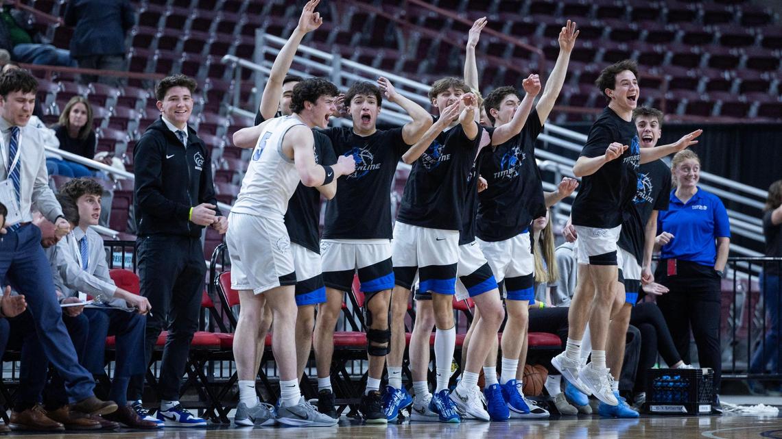 Timberline’s bench celebrates teammate Collin Morris’ fifth 3-pointer against Meridian in the first half of the Wolves’ 60-53 win over the Warriors on Thursday in the 6A boys basketball state tournament at Ford Idaho Center in Nampa.