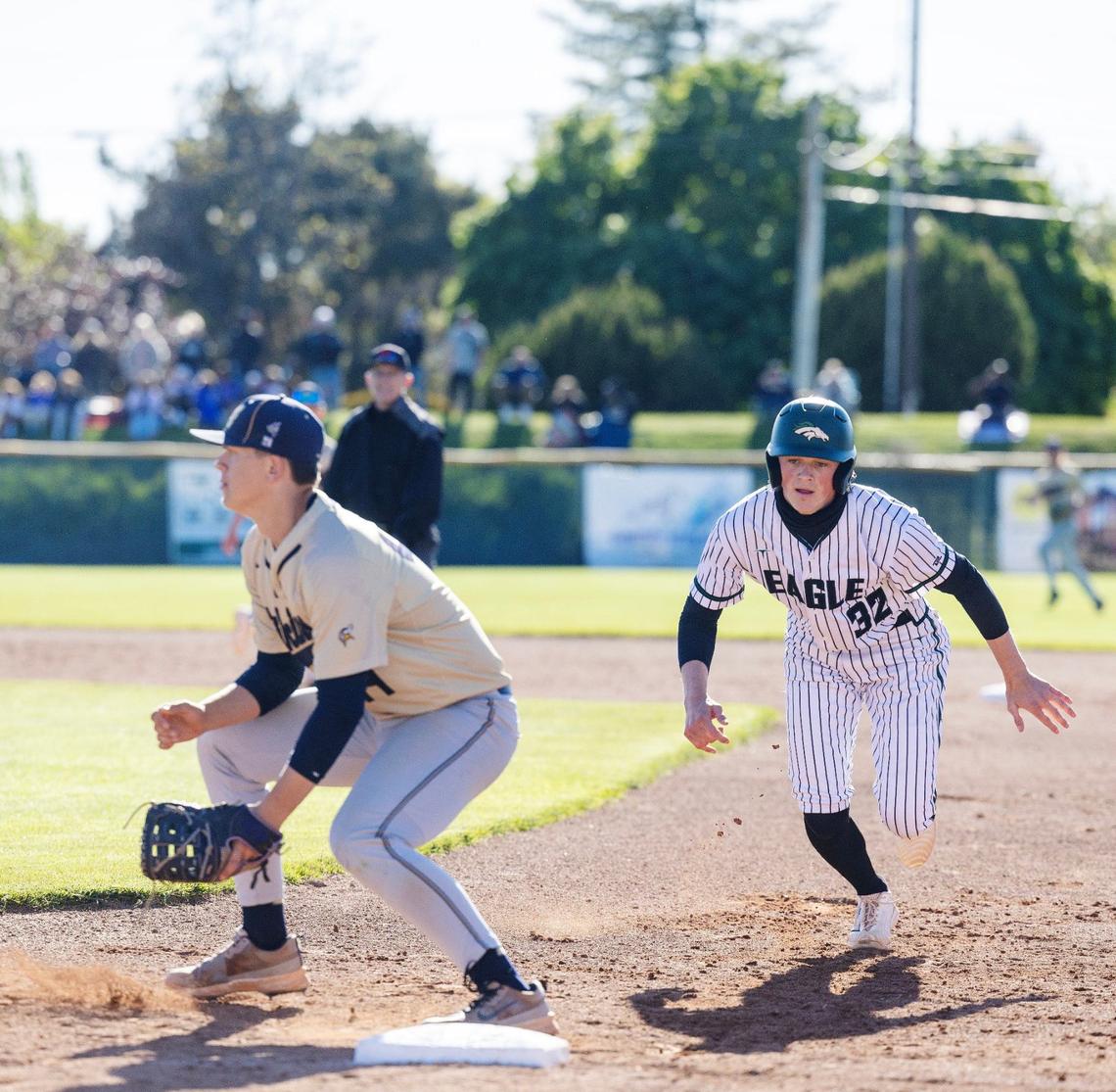 Middleton senior Treyton Swygart waits for the throw on a pickoff attempt of Eagle junior Andrew Palfreyman on Wednesday at Eagle.