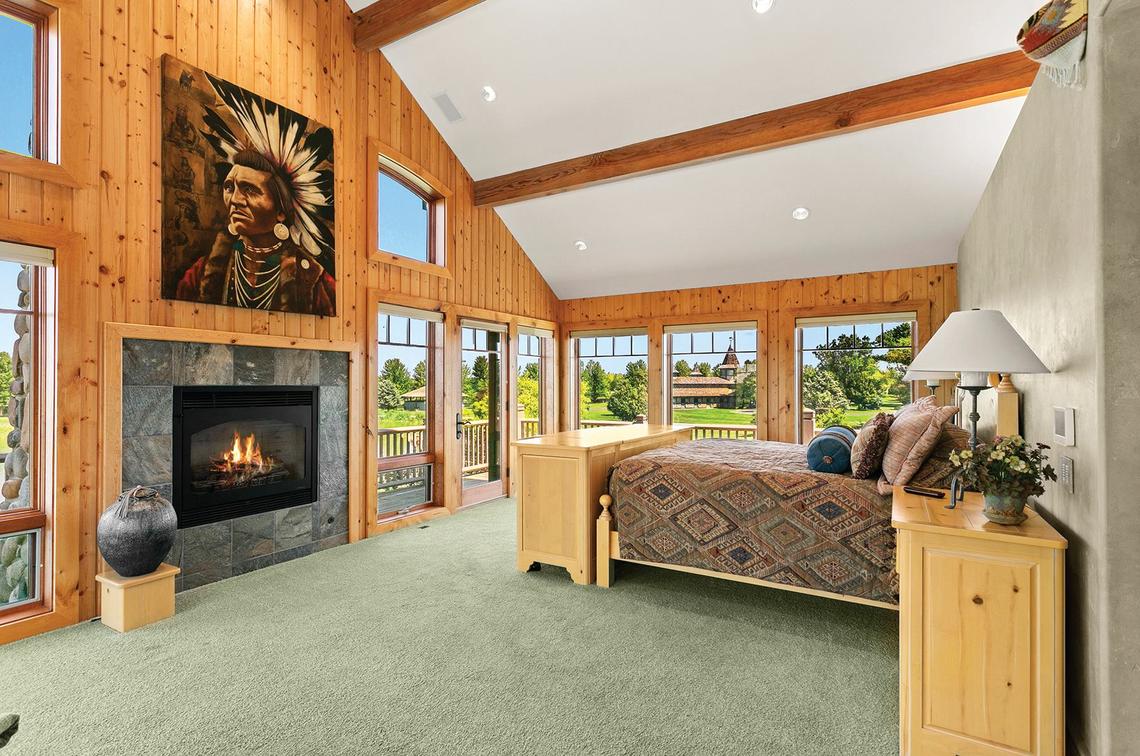 The second floor of the main lodge is dedicated to bedrooms, an office, gym and laundry room. The master bedroom includes a porch on two sides.