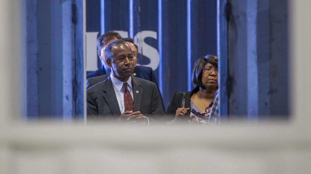 Housing and Urban Development Secretary Ben Carson tours the Caldwell factory of IndieDwell, which converts shipping containers into affordable homes. Carson’s wife, Candy Carson, looks on. Afterward, Ben Carson refused to criticize Lynne Patton, HUD’s top housing official in the New York City area, for a social media post Saturday that Hillary Clinton was involved in the death of financier and accused sex trafficker Jeffrey Epstein.