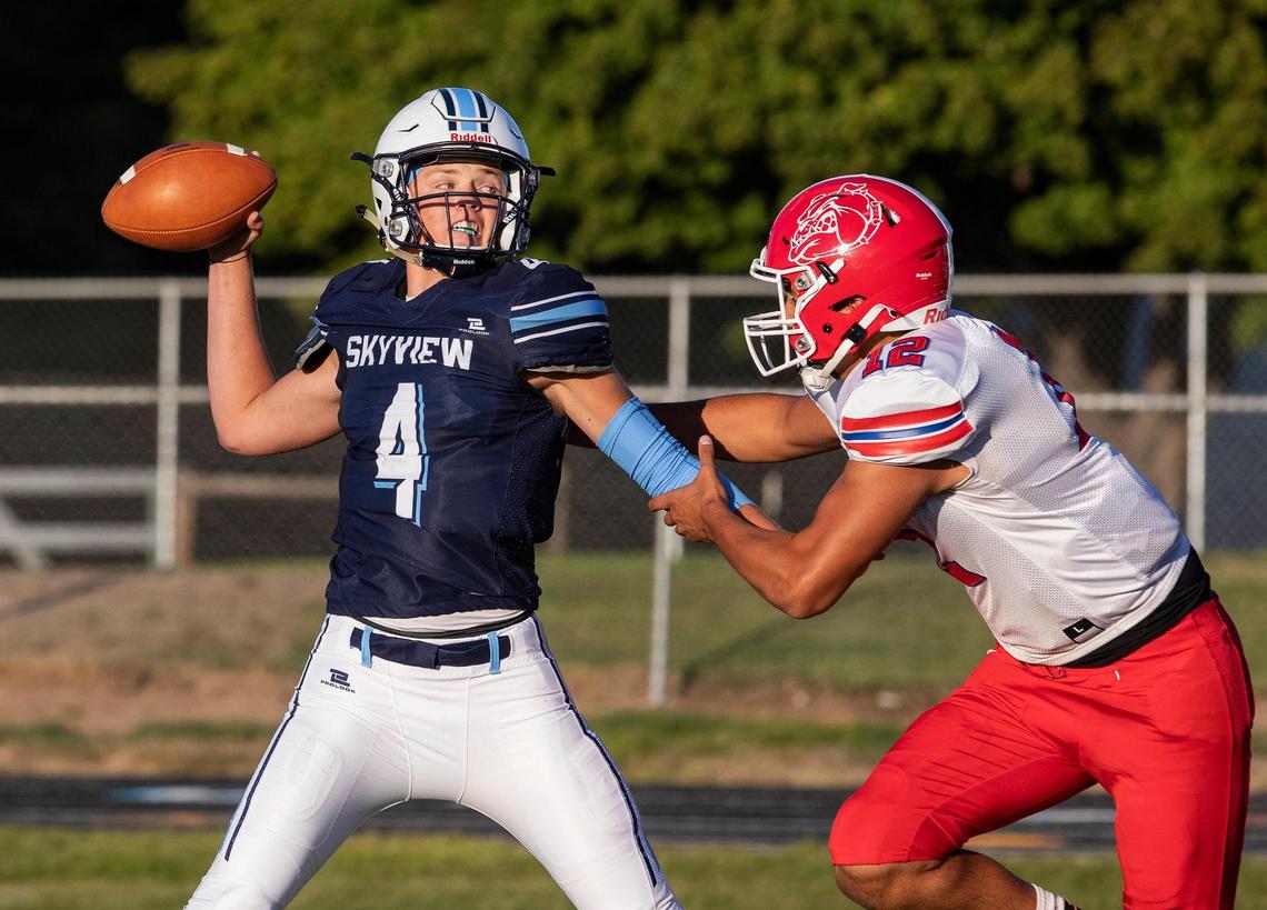 Skyview’s Max Cutforth gets off a pass while under pressure from Nampa’s Payton Gunter. Both are two of the top returning players in the Treasure Valley this fall.