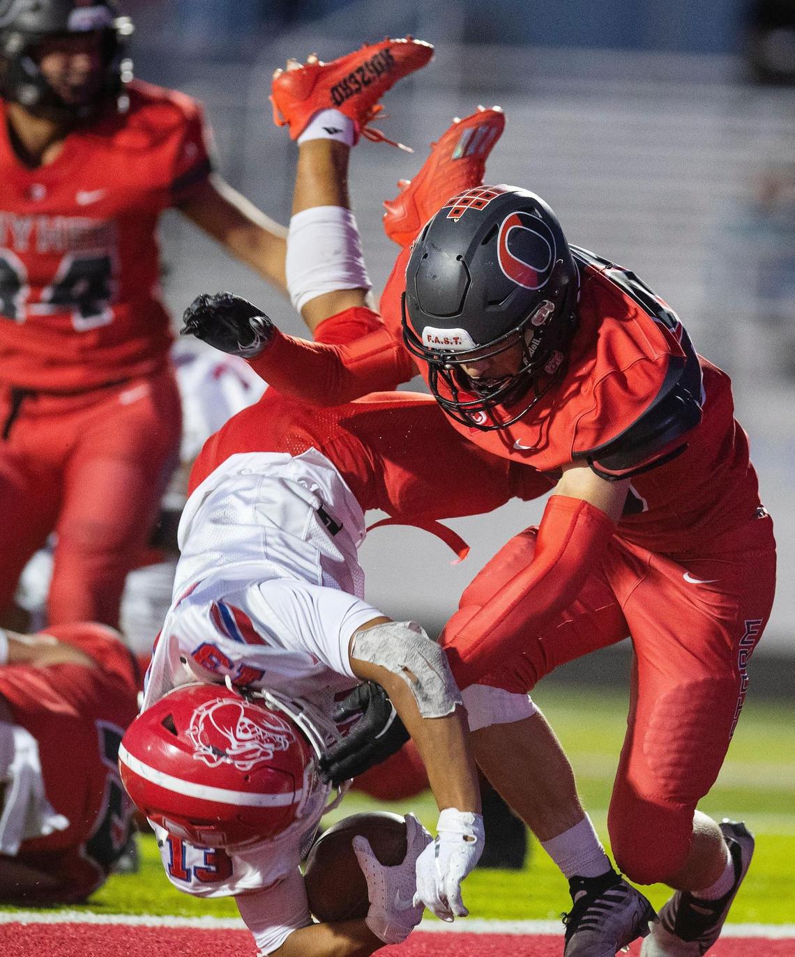 Nampa running back Daniel Carrillo dives into the end zone for the first of his two touchdowns Friday at Owyhee.