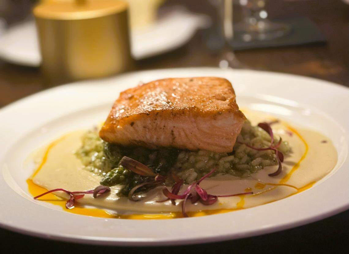 One of the seafood entrees is King Salmon Fillet ($39, fennel cream, spring herb risotto, roasted asparagus).