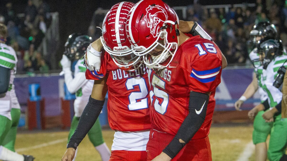 Nampa quarterback Donavon Estrada, left, and Jace Mann console each other after their 35-14 loss against Blackfoot in the 4A state semifinal game Friday at Nampa High.