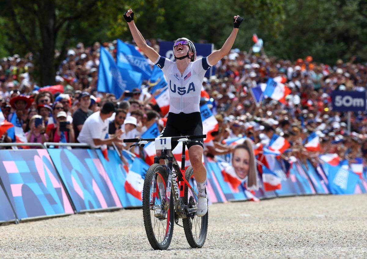 [US, Mexico & Canada customers only] Jul 28, 2024; Elancourt, France; Haley Batten of United States crosses the finish line in second place to win the silver medal during the women's mountain bike cross country event during the Paris 2024 Olympic Summer Games at Elancourt Hill. Mandatory Credit: Piroschka Van De Wouw/Reuters via USA TODAY Sports