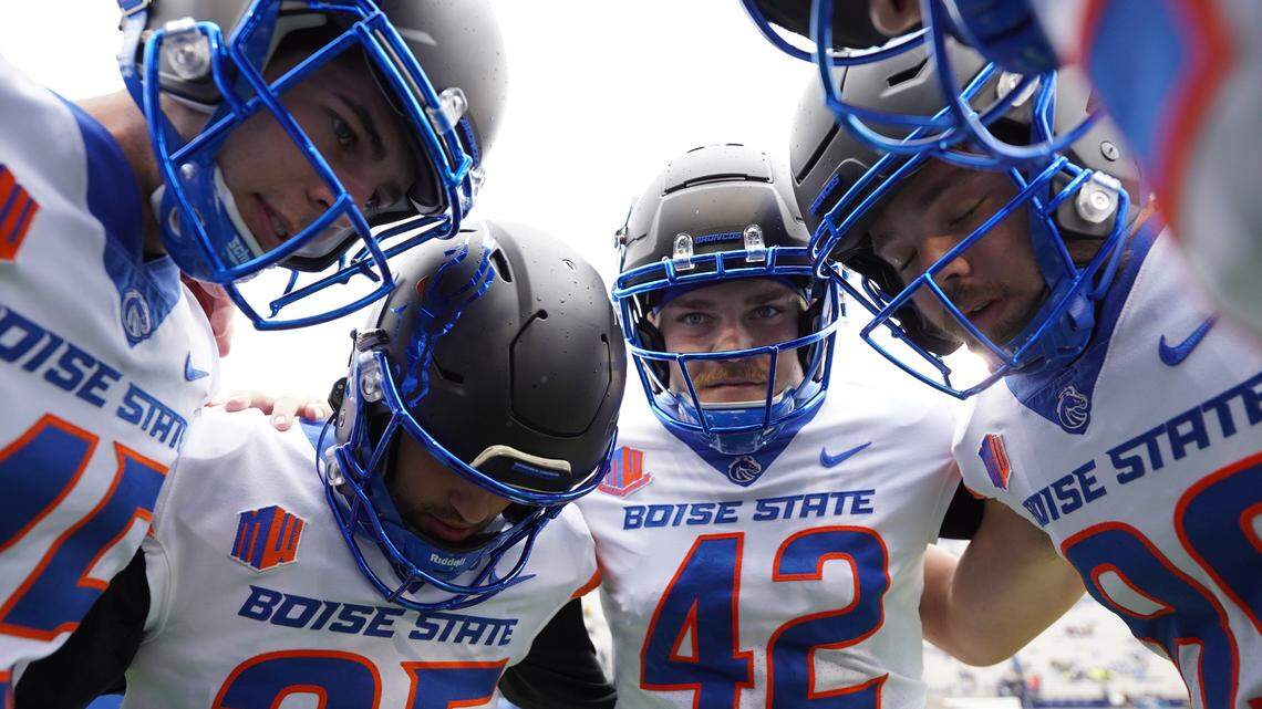 Boise State special teams players Jonah Dalmas, second from left, and Daniel Cantrell huddle before kickoff in the Broncos’ win at BYU in October. Cantrell, the team’s long snapper, has declared for the NFL Draft.