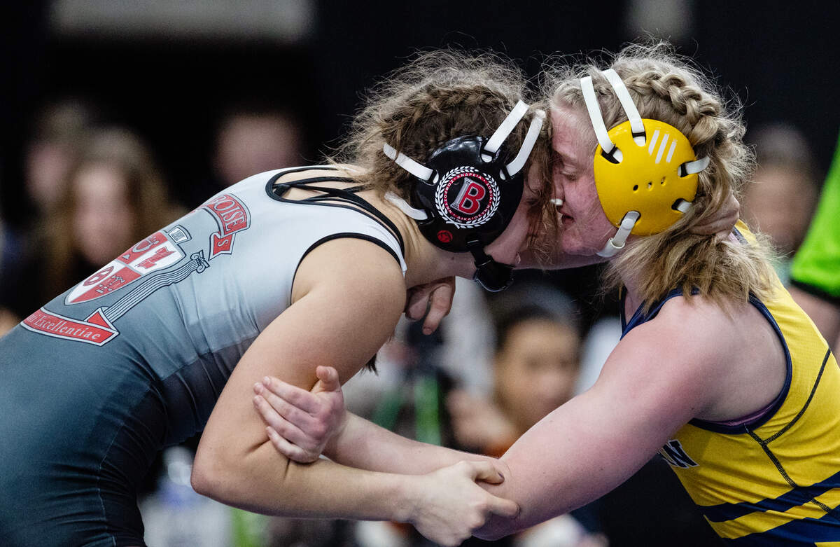 Clare Waite of Boise, left, and Elise Twait of Meridian, compete for the girls 135-pound title at the Rollie Lane Invitational at Ford Idaho Center last season. Waite won.