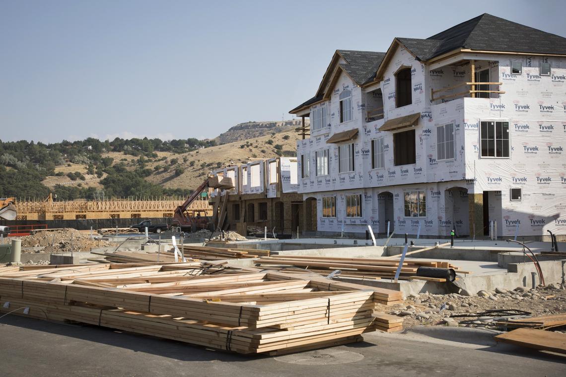 Brighton Homes has completed some townhouses, and others are under construction in Park Place at Barber Station on East Barber Valley Drive. Warm Springs Mesa and, farther back, Table Rock, are visible from the valley.